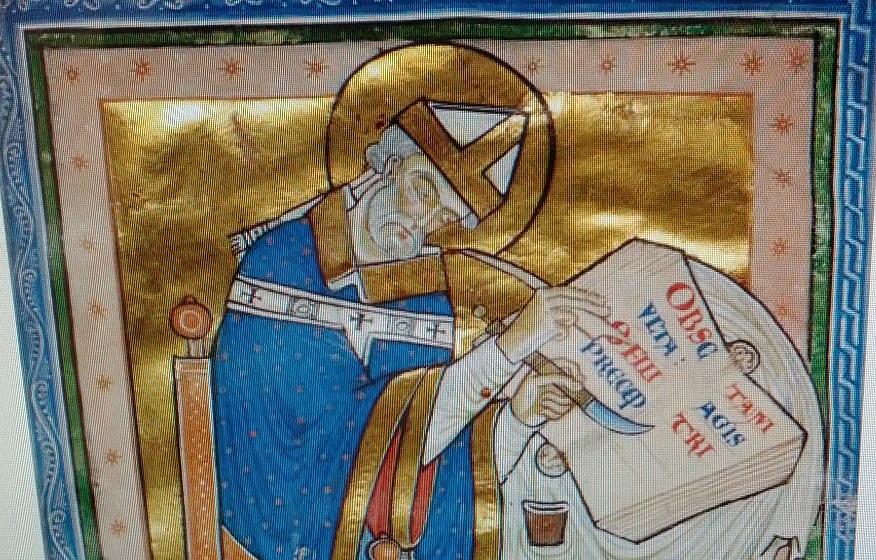 A Medieval monk cuts up the pages of a book with a knife
